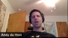 A handsome man wearing headphones during a Zoom call